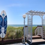 Surfboard shower and beach entrance